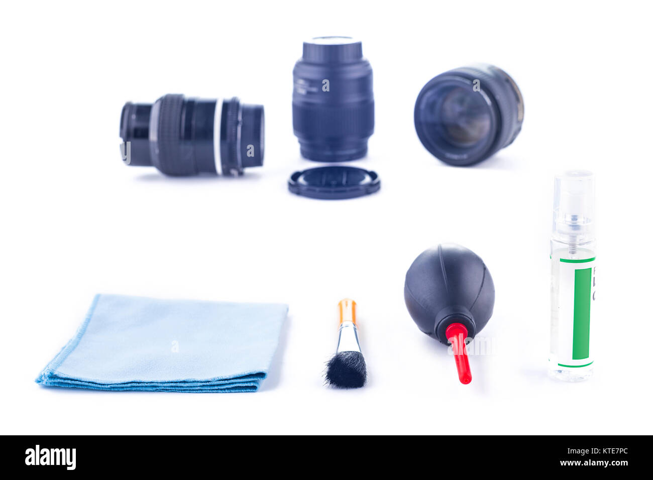 Cleaning kit for camera lenses on a white background, photographer