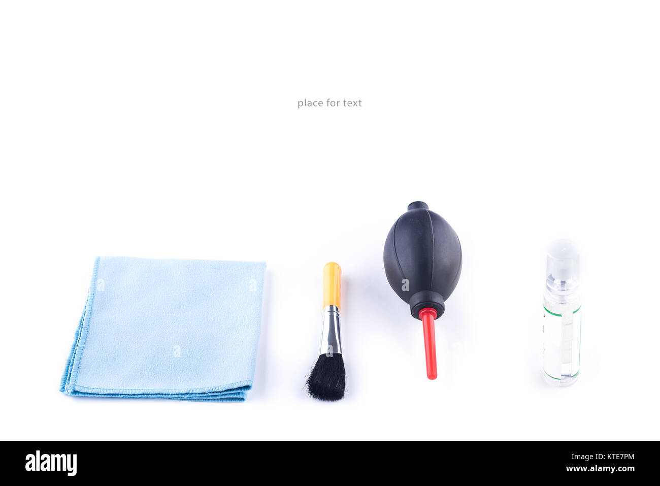 Cleaning kit for camera lenses on a white background, photographer