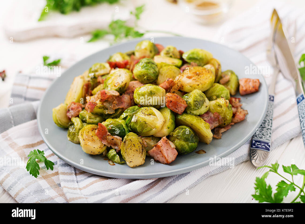 Brussels sprouts. Roasted Brussels sprouts with bacon. Delicious lunch. Stock Photo