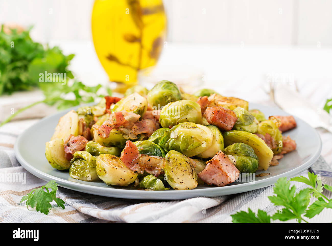 Brussels sprouts. Roasted Brussels sprouts with bacon. Delicious lunch. Stock Photo