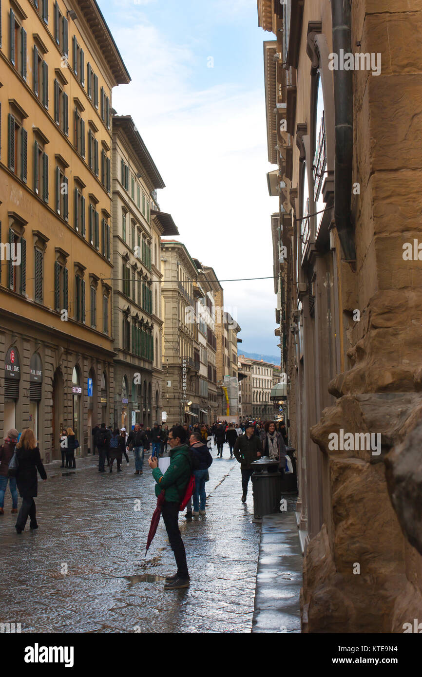 FLORENCE, ITALY - FEBRUARY 06, 2017: The old medieval street in Firenze, after the rain Stock Photo