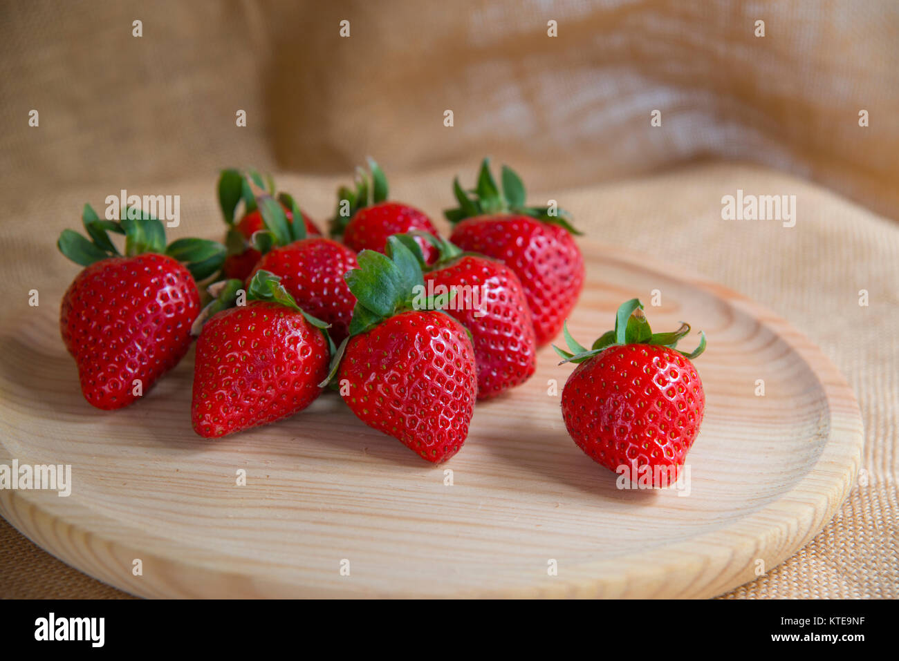Strawberries on wooden dish. Still life. Stock Photo