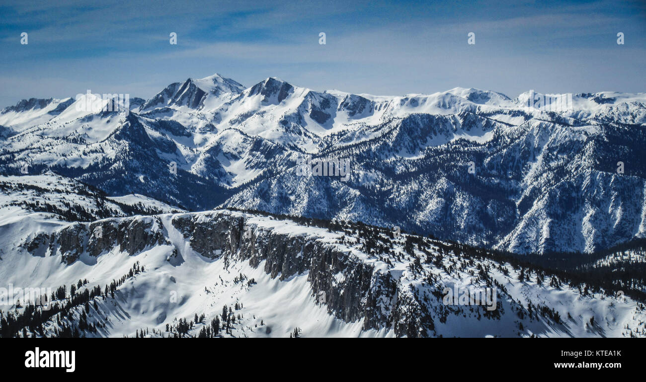 Panoramic view of snow-covered Sierra Nevada Mountain Range from the summit of Mammoth Mountain, Mammoth Lakes, California Stock Photo