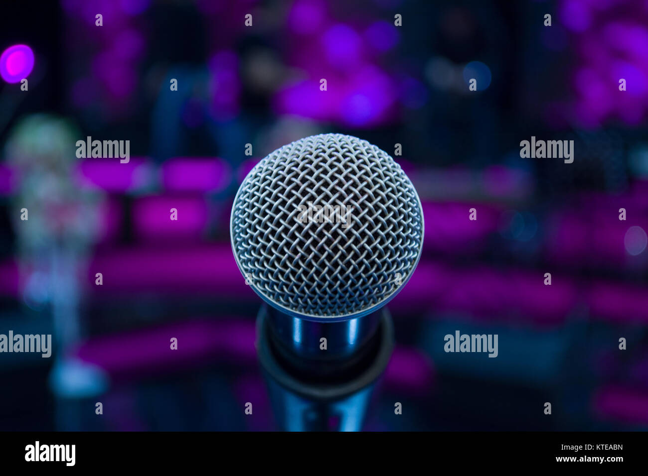 microphone against blur colorful light background Stock Photo - Alamy microphone against blur colorful light background Stock Photo - Alamy
