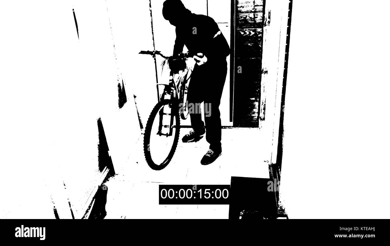 surveillance camera caught the thief broke the door and stole the bike threshold effect Stock Photo