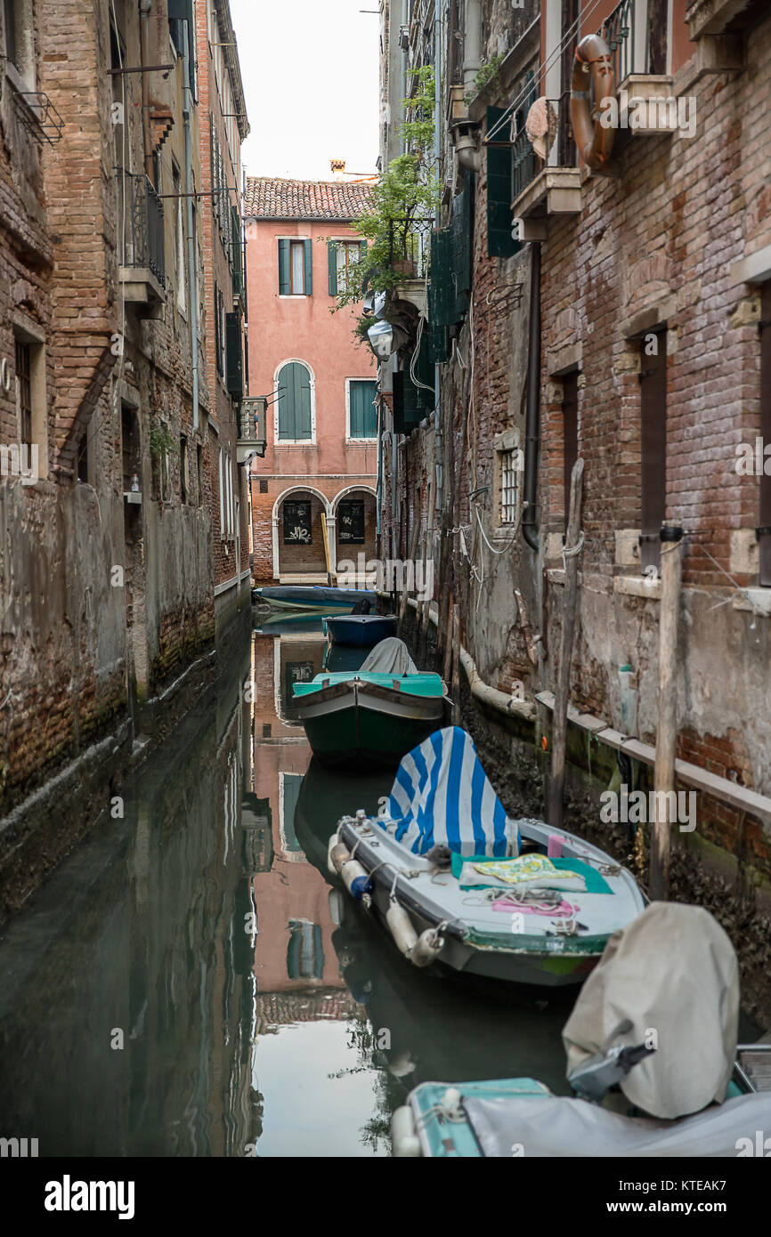 Beautiful photo of the Venetian canal with old houses , Italy . Stock Photo