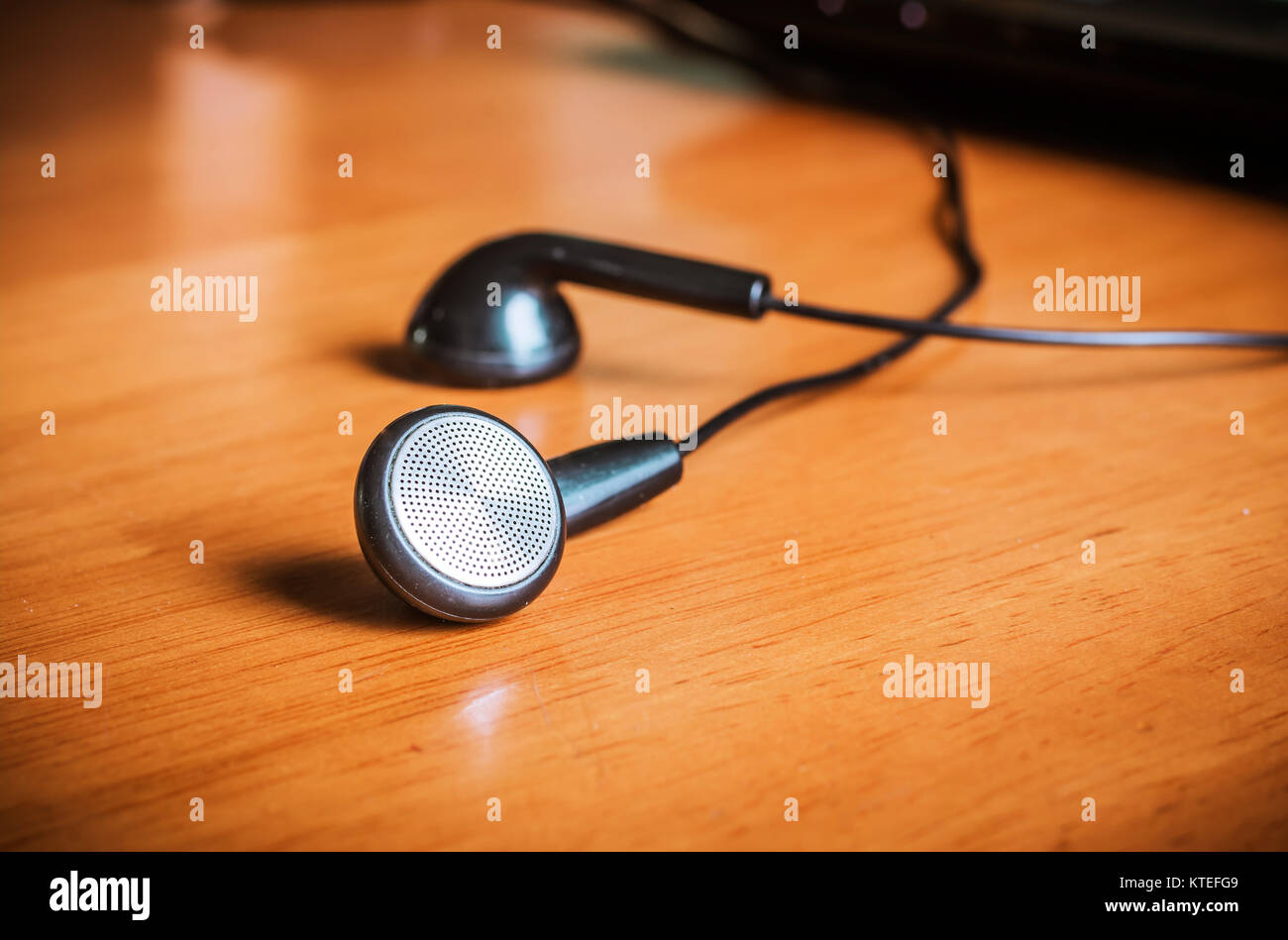 earphones on wood board Stock Photo Alamy