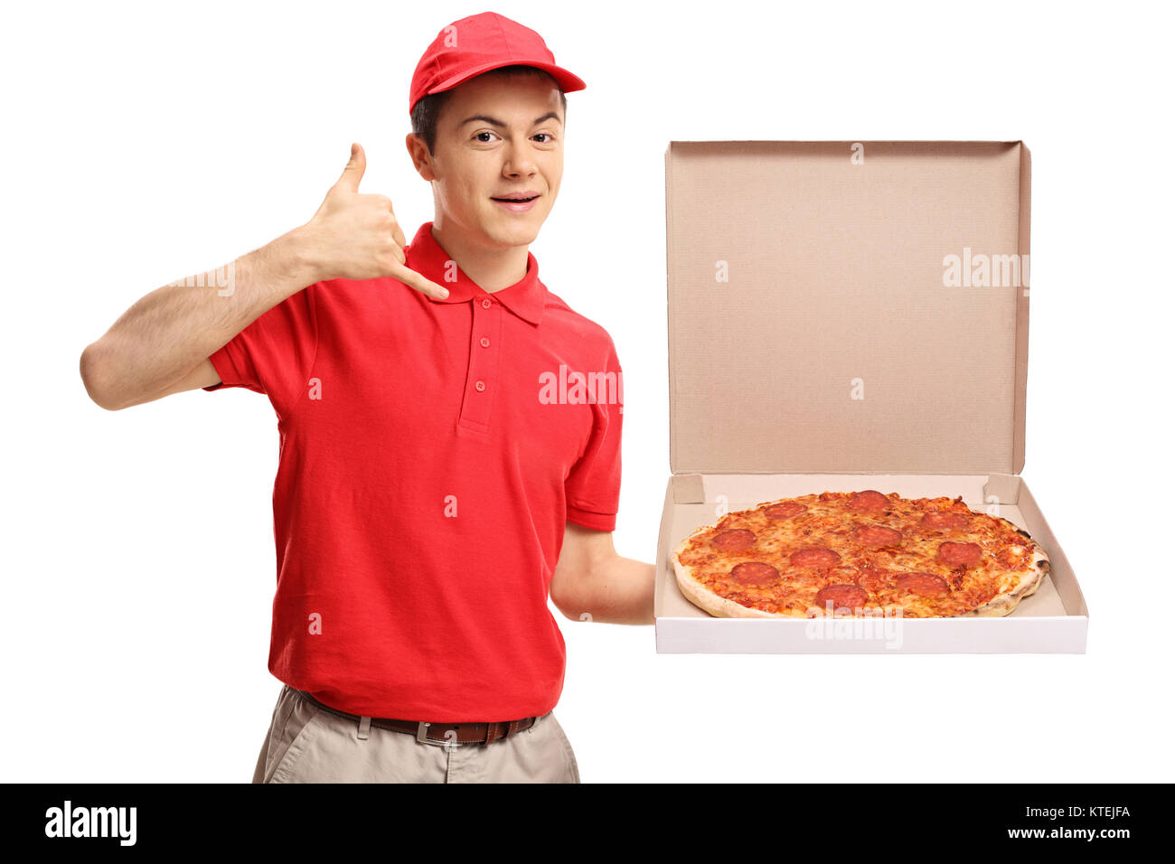 Teenage pizza delivery boy holding a pizza box and making a call me