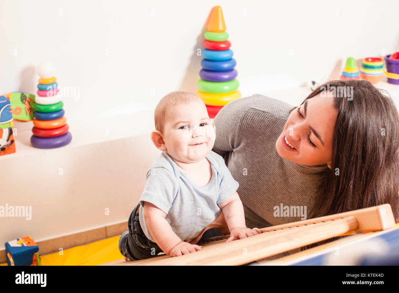Child climb ladder parent help hires stock photography and images Alamy