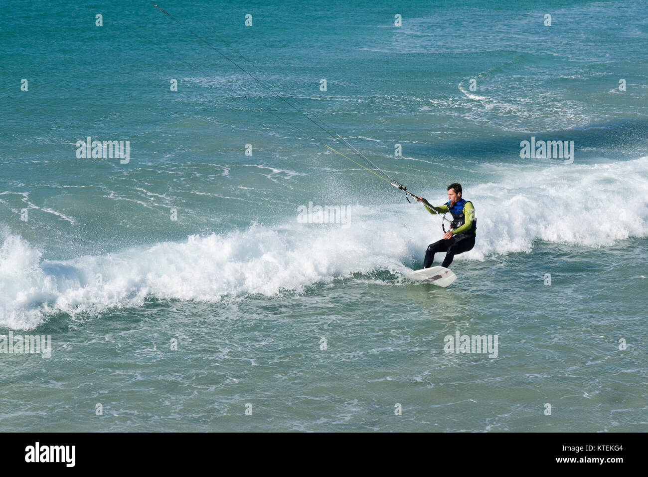 Kitesurfer, wave riding, kitesurf ride waves in Tarifa, Andalusia, Spain. Stock Photo