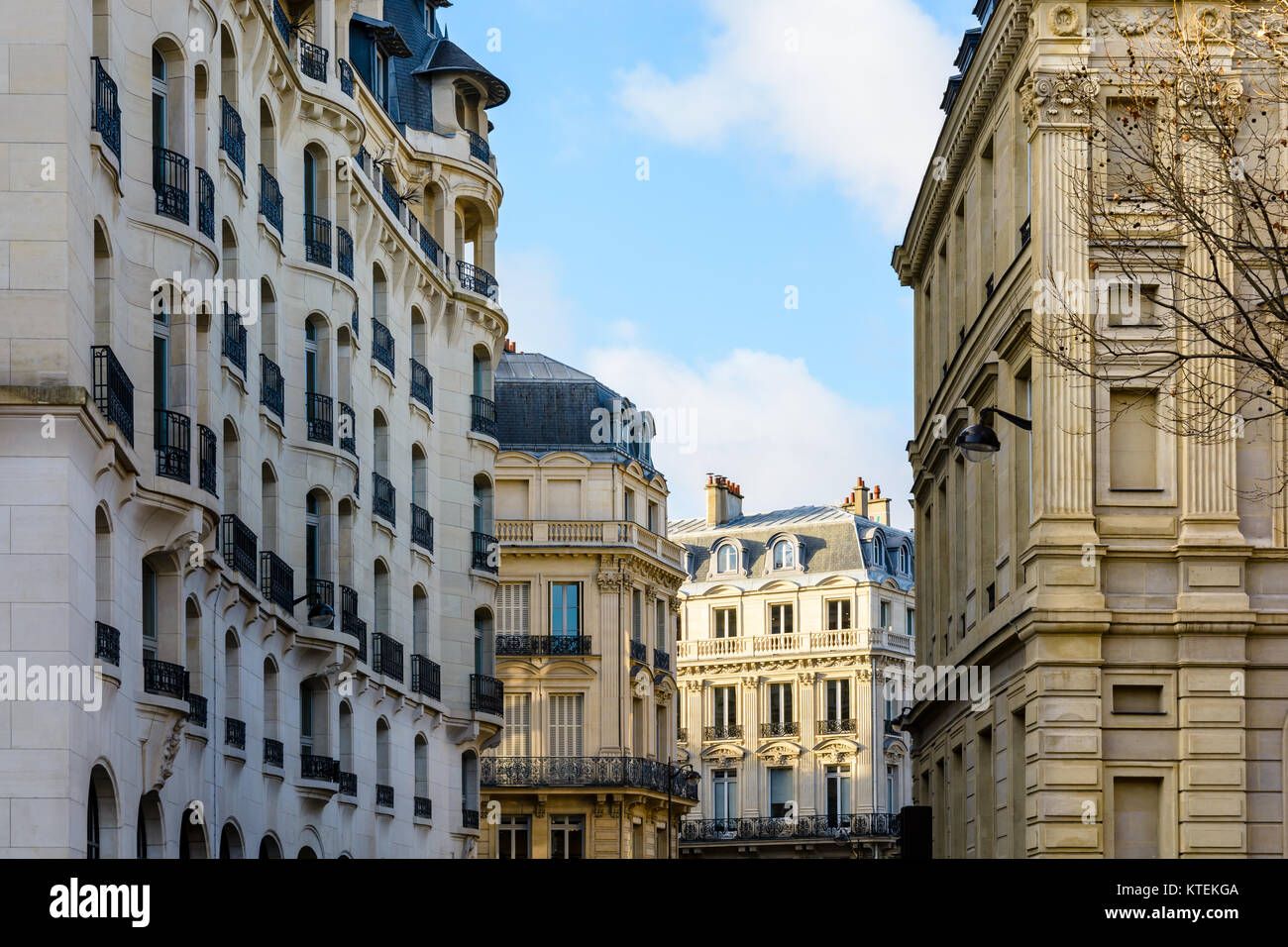 Typical residential buildings of Haussmannian and Art Deco style in chic neighborhoods of Paris, France, at sunset. Stock Photo