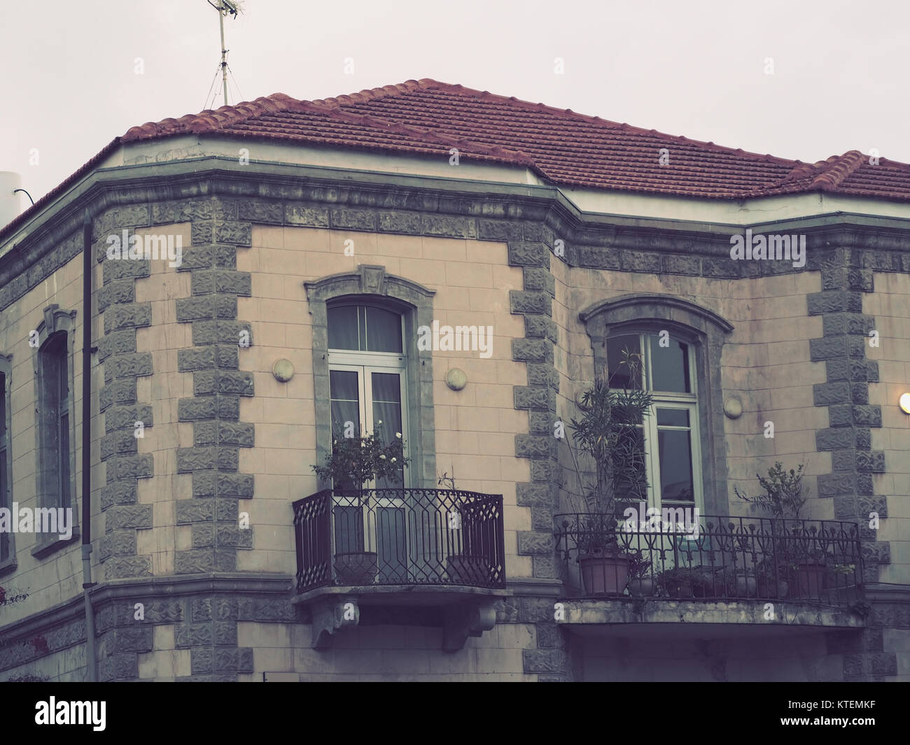 old classic residence house with stone walls roof tiles balcony and ...