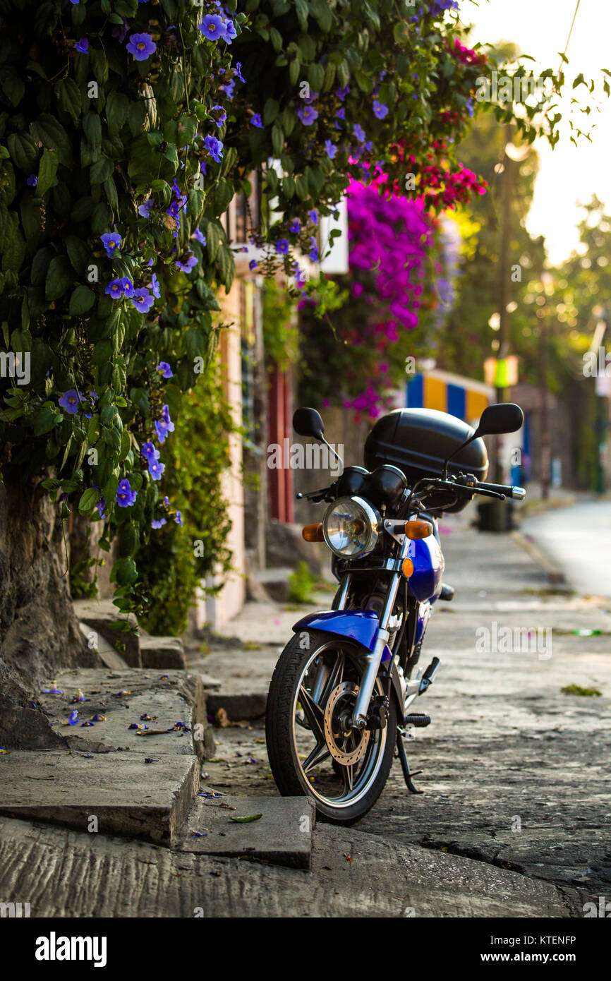 Old motorcycle on the street of Cuernavaca at daylight Stock Photo