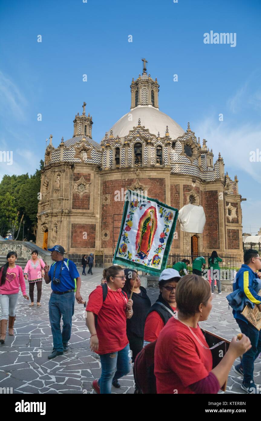 VILLA OF GUADALUPE, MEXICO CITY, DECEMBER 02, 2017 - Pilgrims carring a banner with the image of the Virgin of Guadalupe. Stock Photo