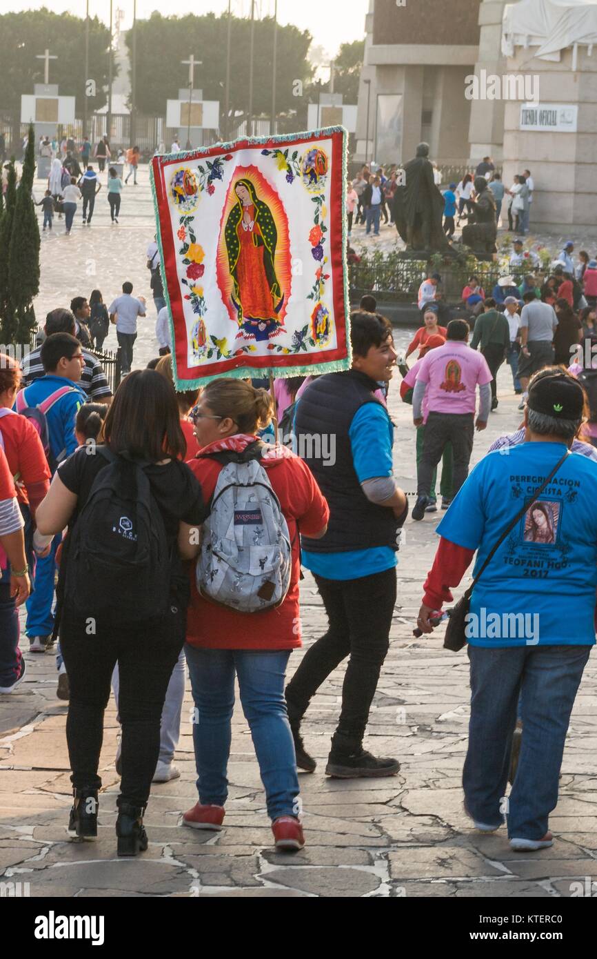 VILLA OF GUADALUPE, MEXICO CITY, DECEMBER 02, 2017 - Pilgrims carring a banner with the image of the Virgin of Guadalupe. Stock Photo