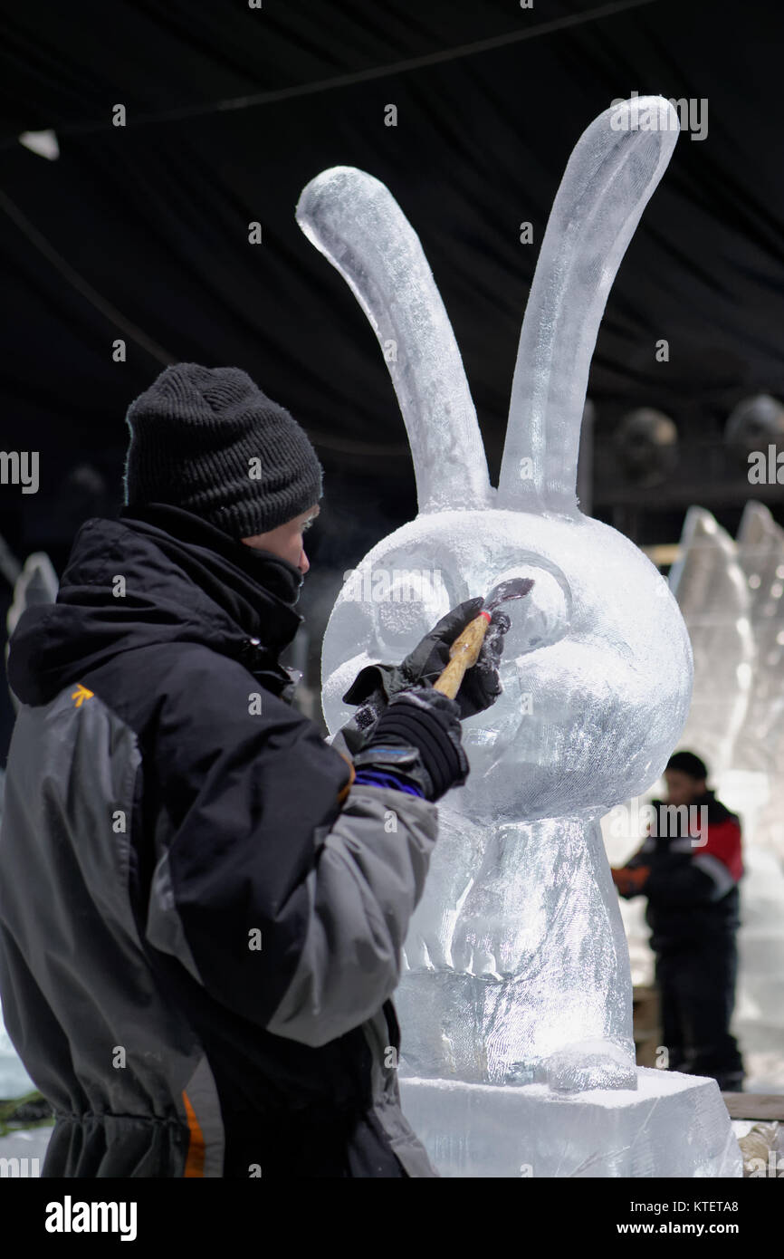 St. Petersburg, Russia - December 19, 2017: Sculptor prepares the statue of hare for the opening of the festival Ice Fantasy - 2018. This year 180 ton Stock Photo