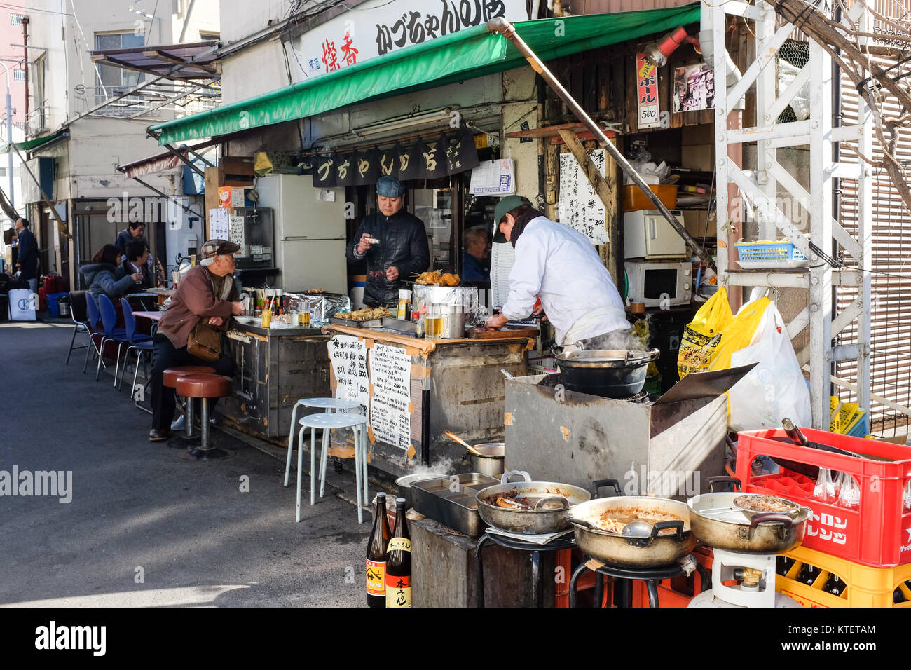 A small restaurant near Asakusa in Tokyo, Japan, where people can also dine on tables outside. Stock Photo