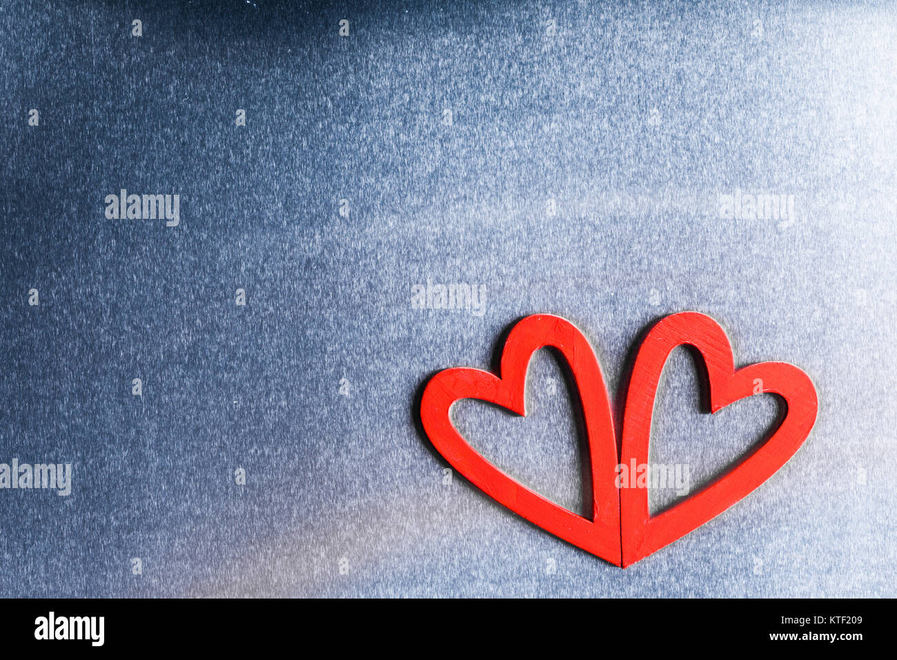 Two red wooden hearts on metal background with copy space Stock Photo ...
