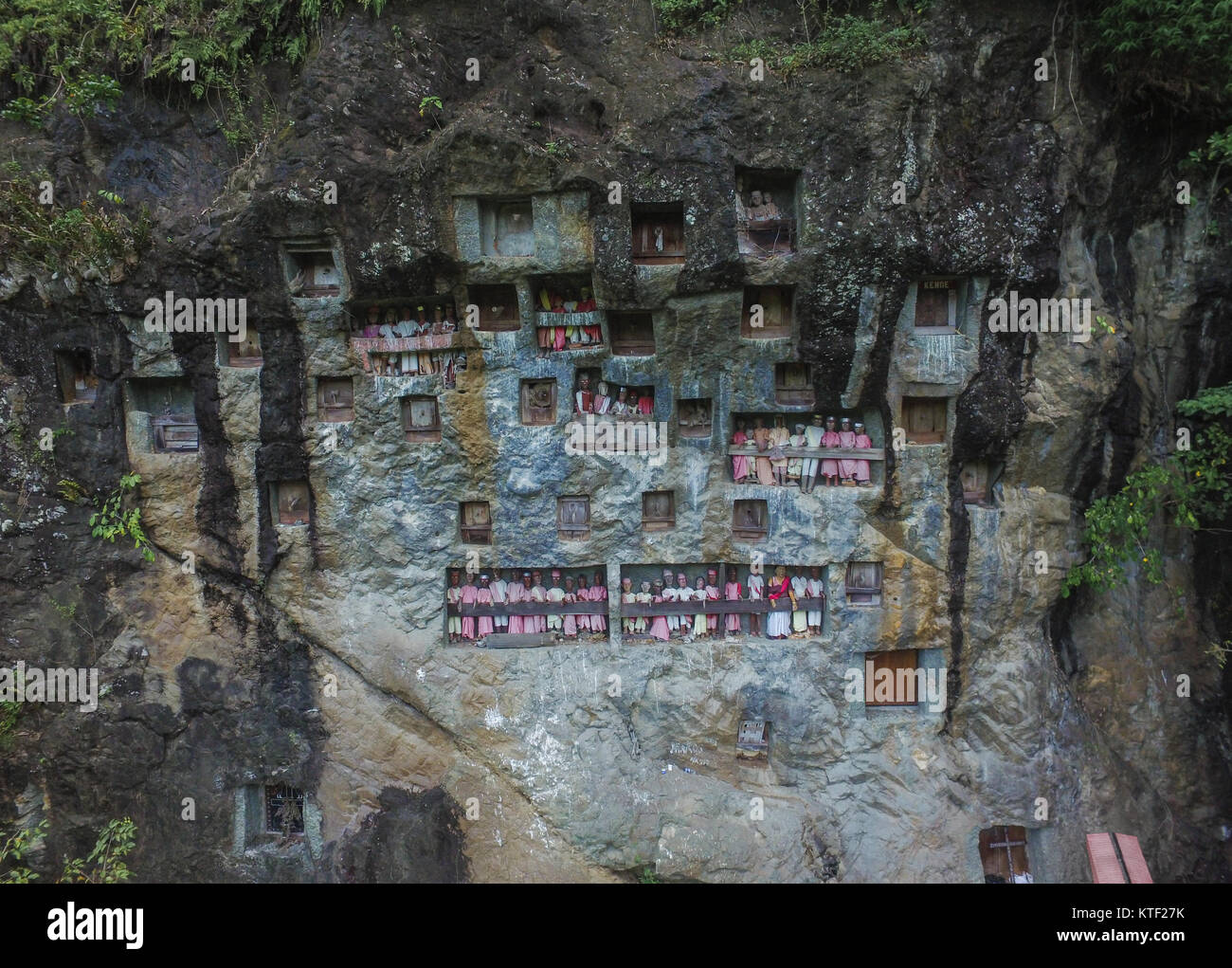 Londa Burial Caves in Rantepao, Toraja. The unique funeral practices of the Toraja can be seen here with graves carved into caves and hung off cliffs. Stock Photo