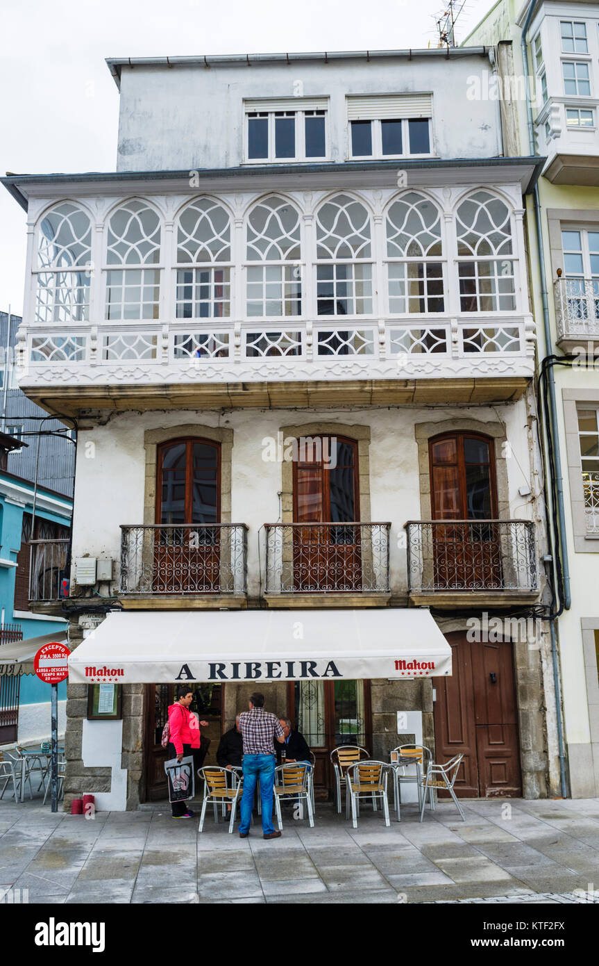 Bar at a traditional Galician architecture building with glass gallery at Viveiro, Lugo Province, Galicia, Spain, Europe Stock Photo