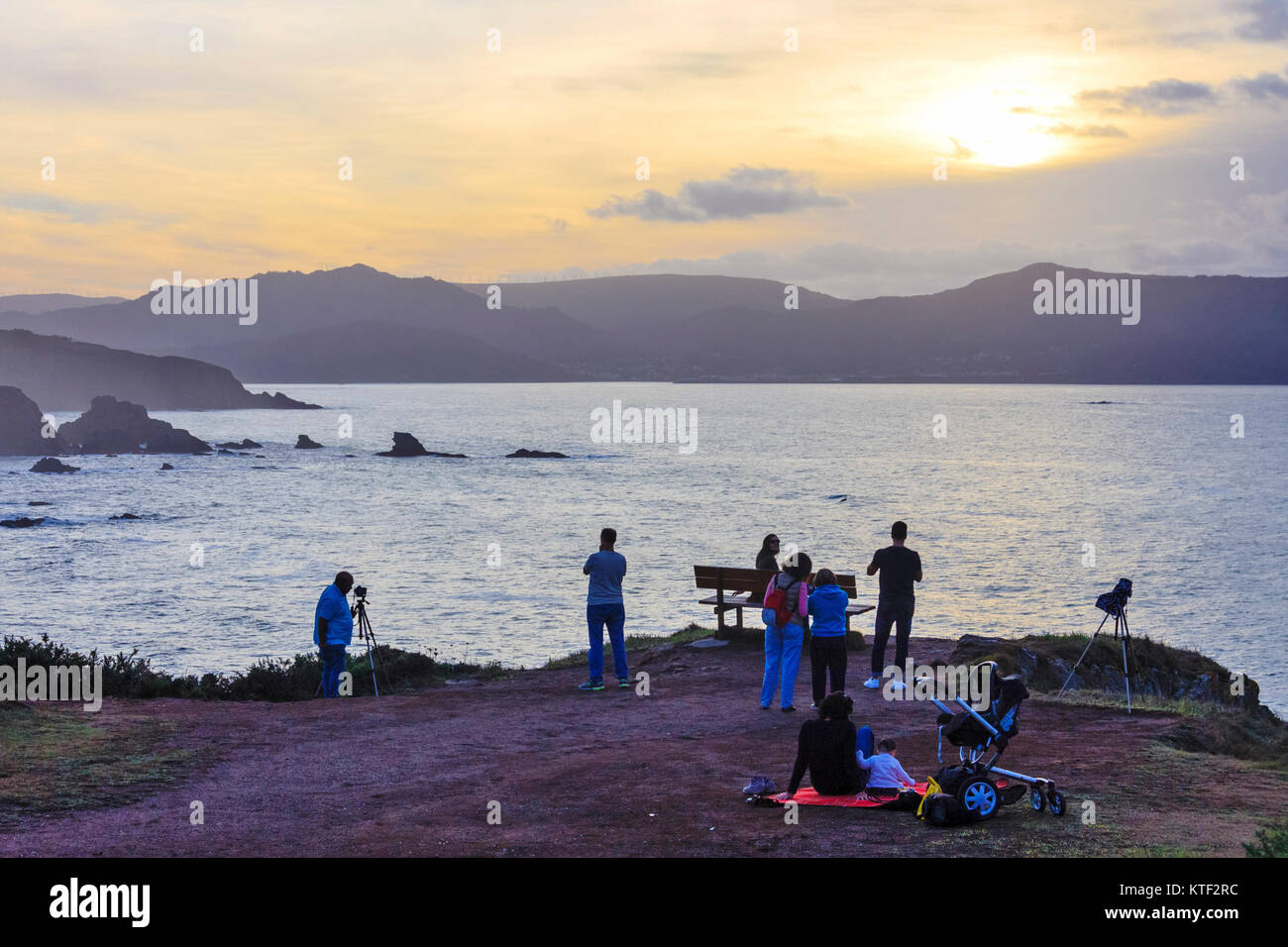 Tourists looking at the sunset at the Loiba cliffs (Acantilados de Loiba) Coruña province, Galicia, Spain, Europe Stock Photo