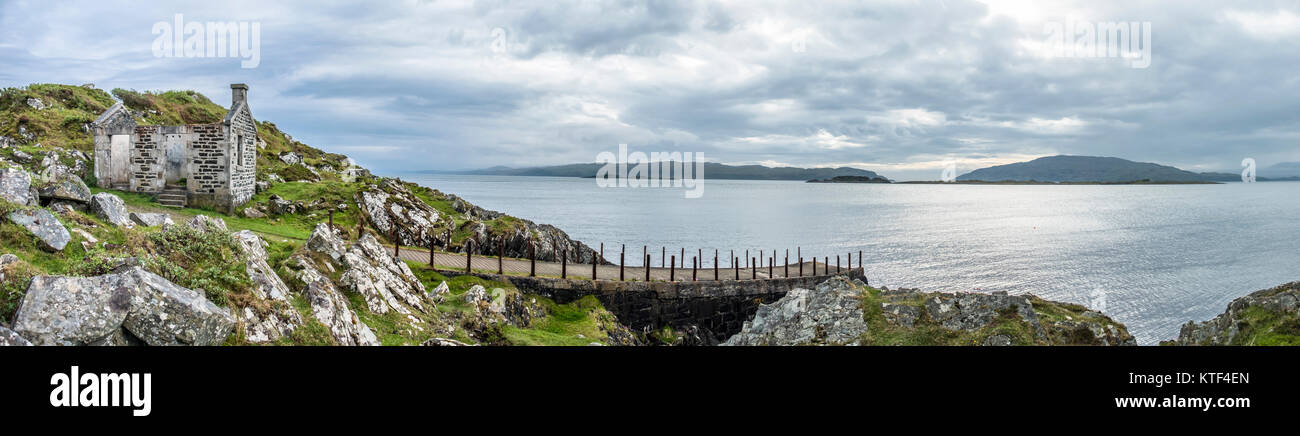 The rotten pier at Craignish point with the Sound of Jura in the background, Scotland Stock Photo