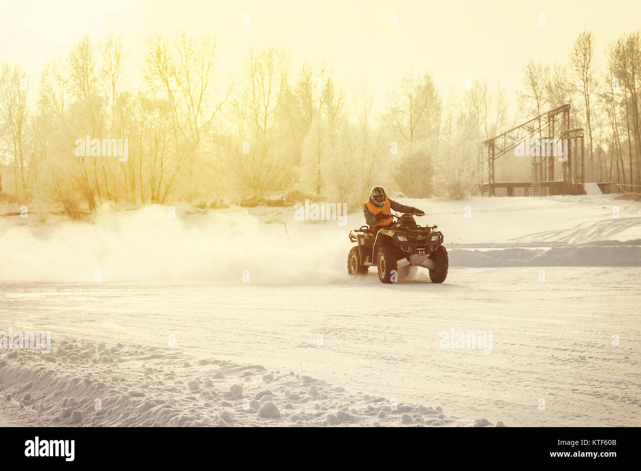 ATV driving on a snowy highway. Winter event on the Quad. extreme