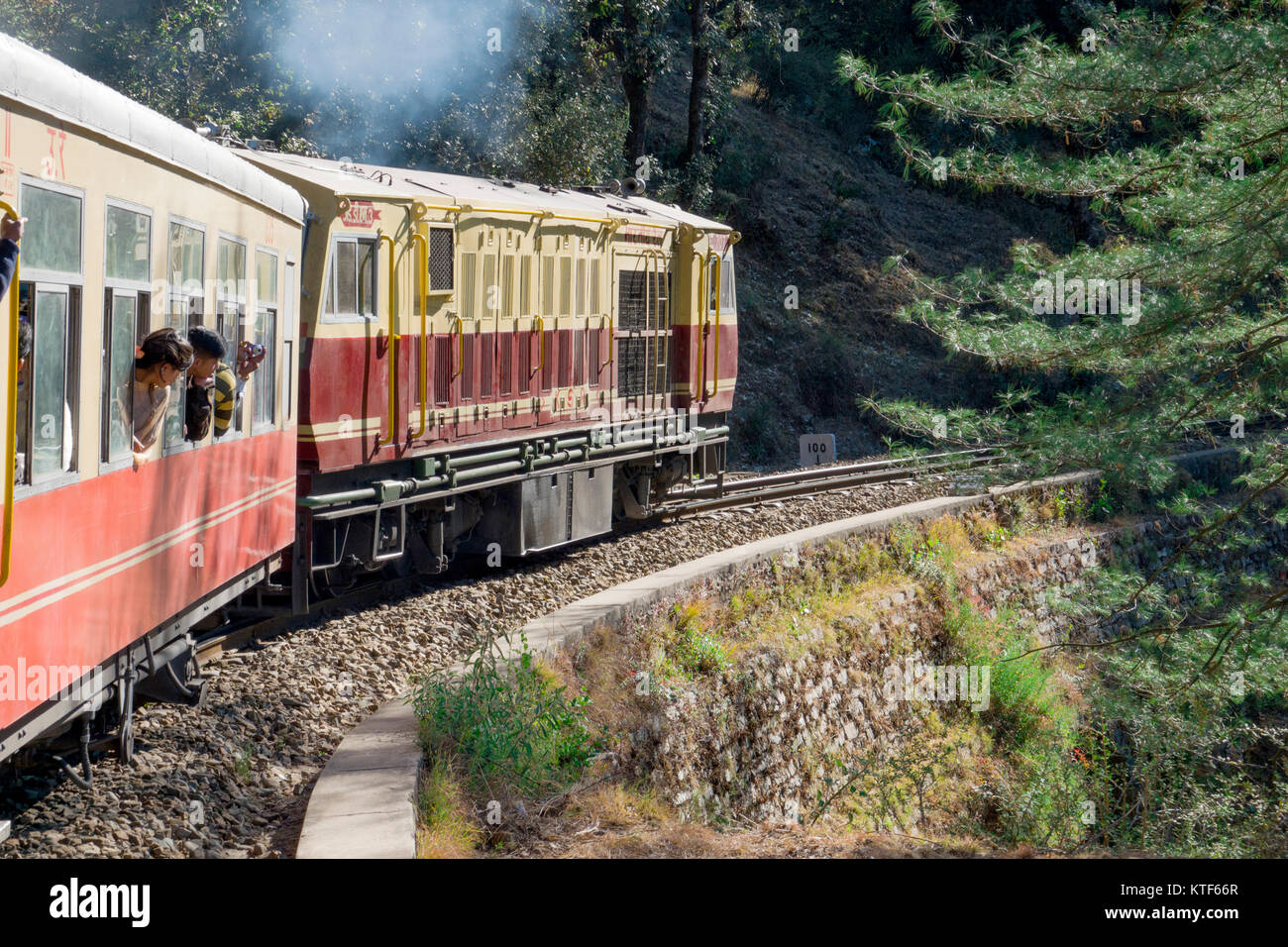 Shimla Kalka narrow gauge toy train on scenic journey to Kalka, Haryana, India Stock Photo