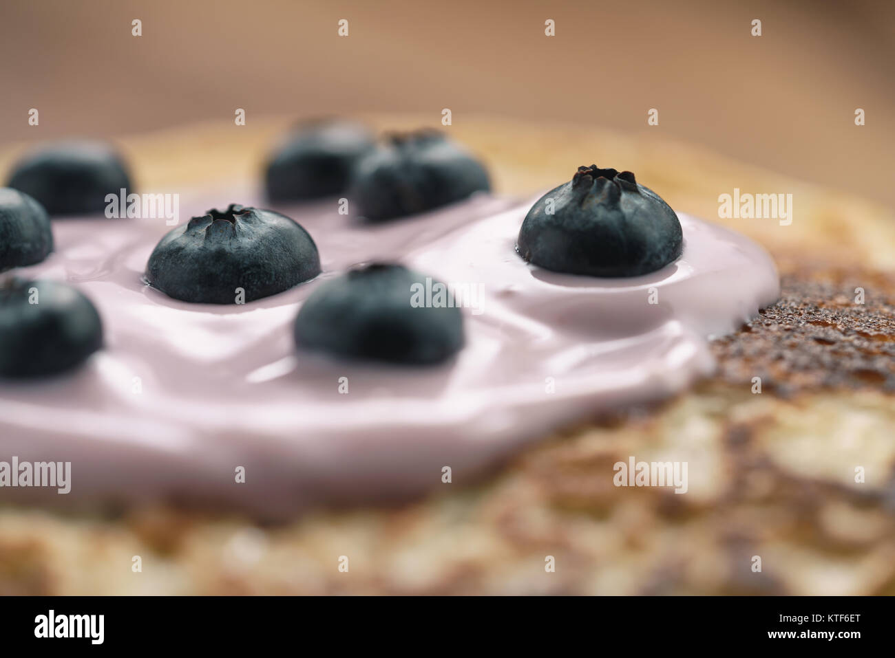 blini or crepes with yogurt and blueberries closeup Stock Photo