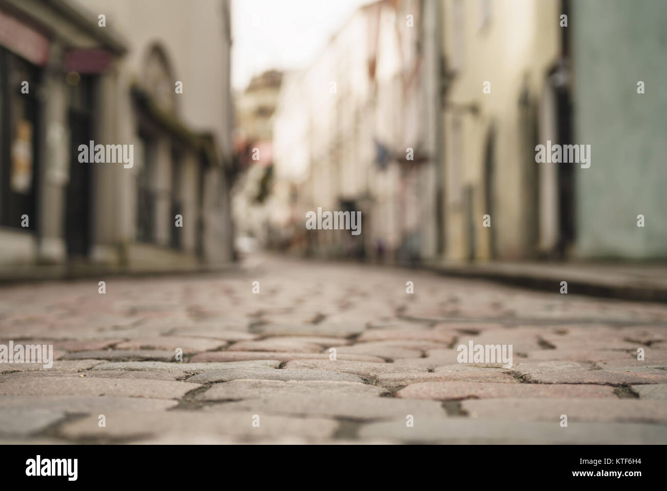 low angle closeup background of old pavement with blurred background Stock Photo