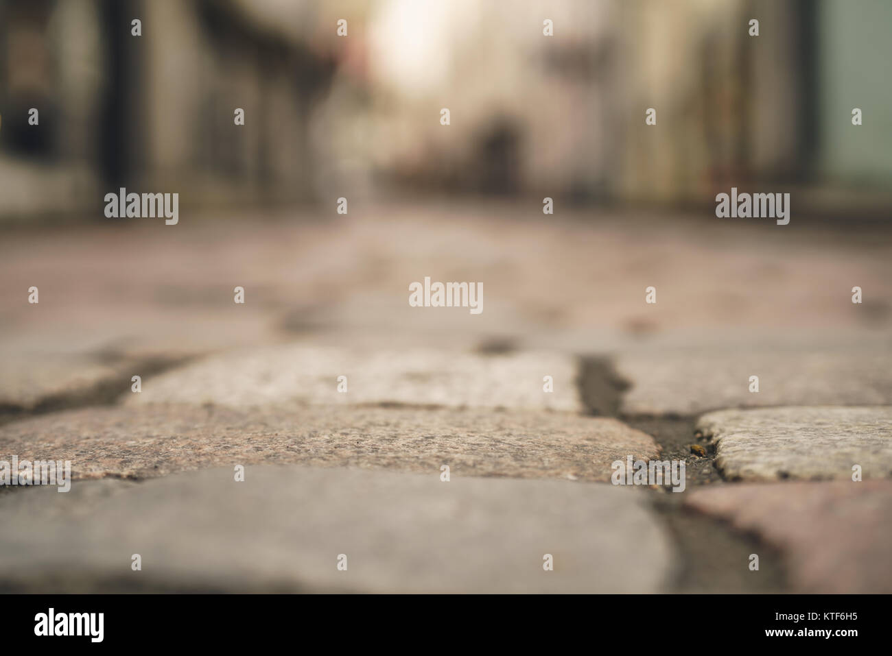 low angle closeup background of old pavement with blurred background Stock Photo
