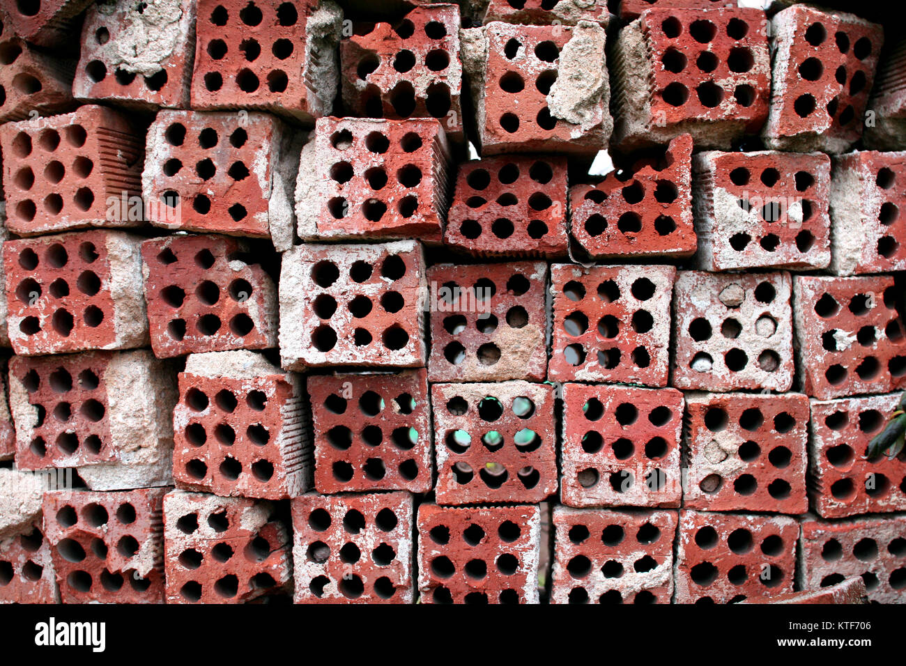 Old used bricks with holes Stock Photo