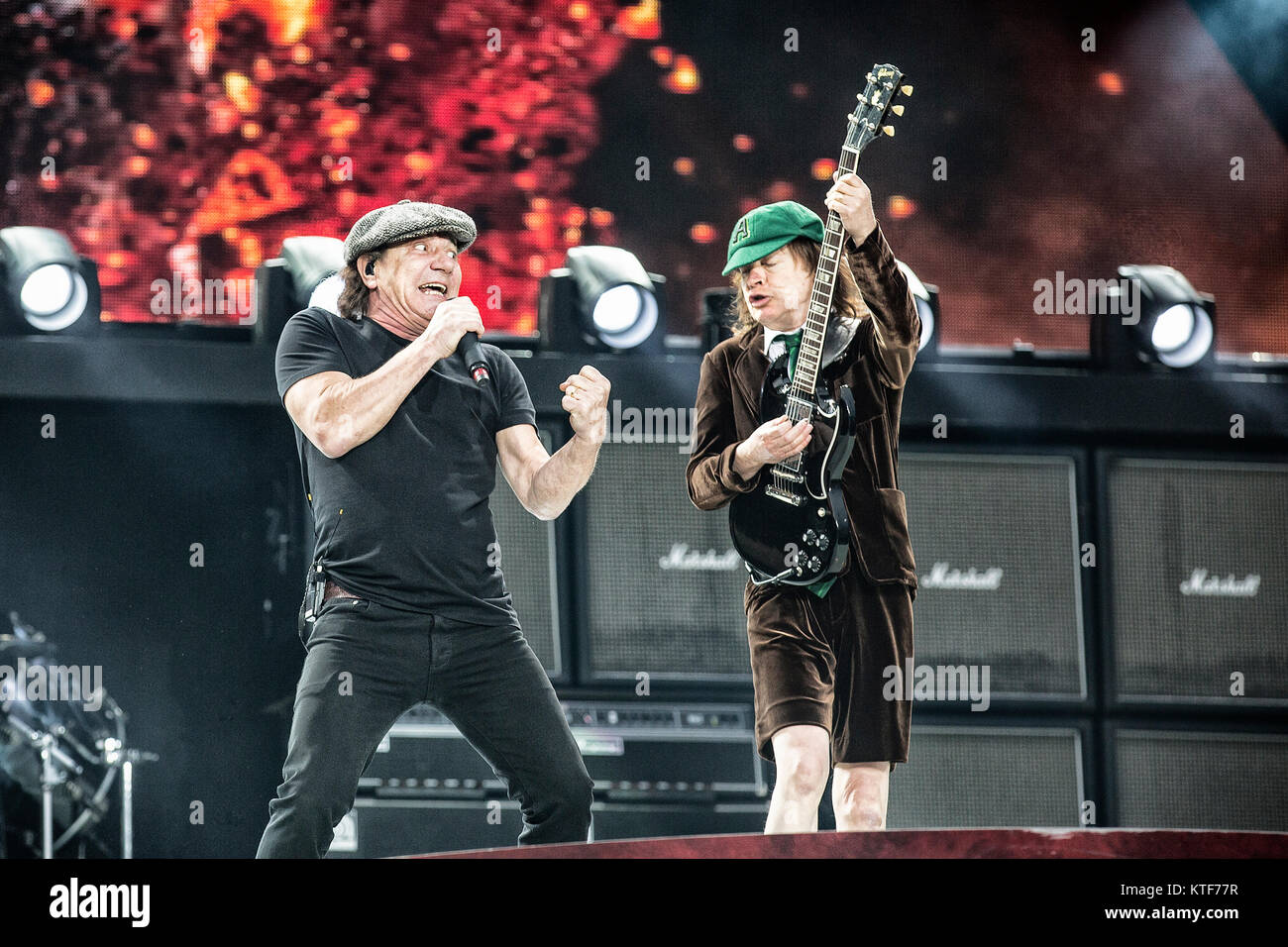The Australian rock band AC/DC performs a live concert at Valle Hovin Stadion in Oslo as part of the Rock or Bust World 2015 Tour. Here musician and guitarist Angus Young (R) is seen live on stage with vokalist Brian Johnson (L). Norway, 17/07 2015. Stock Photo