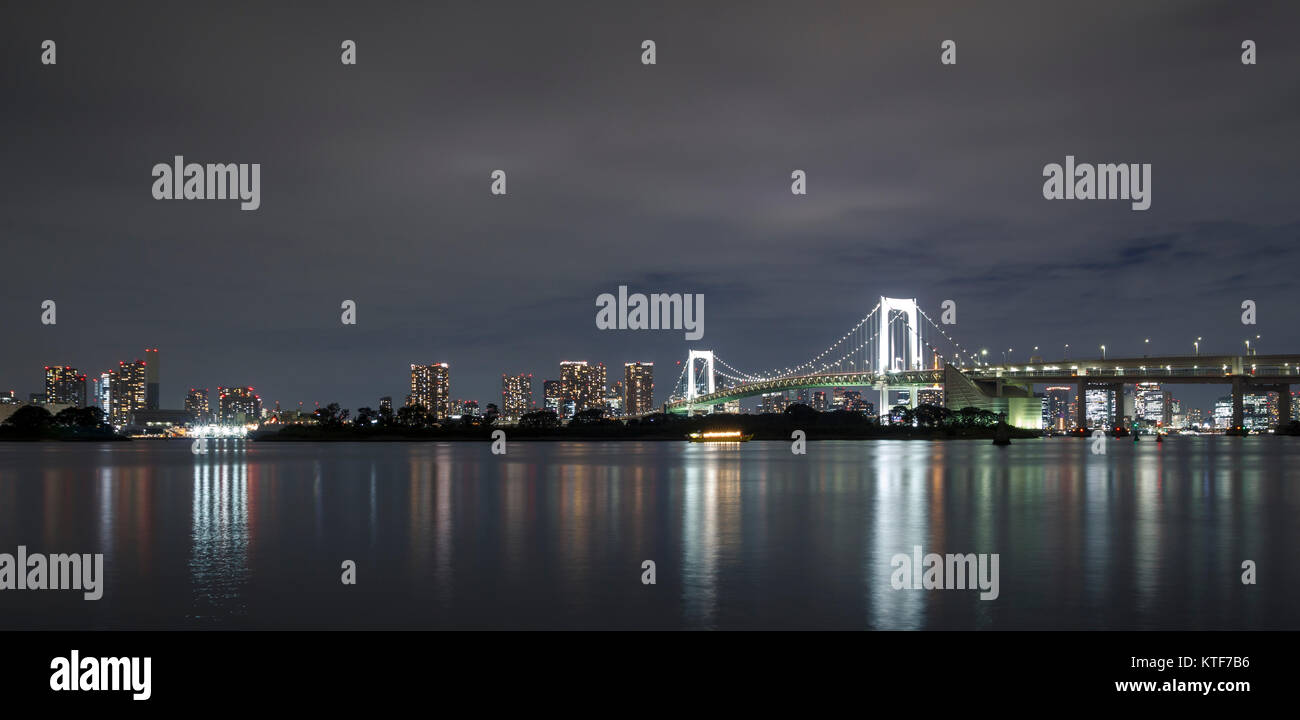 Tokyo skyline on the bay with Rainbow Bridge, shot from Odaiba Stock Photo