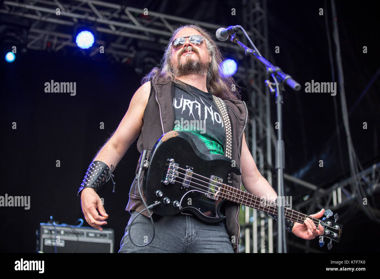 Norway, Borre – August 19, 2017. The Norwegian black metal band Aura Noir performs a live concert at during the Norwegian metal festival Midgardsblot Festival 2017 in Borre. Here vocalist and bassist Aggressor is seen live on stage. Stock Photo