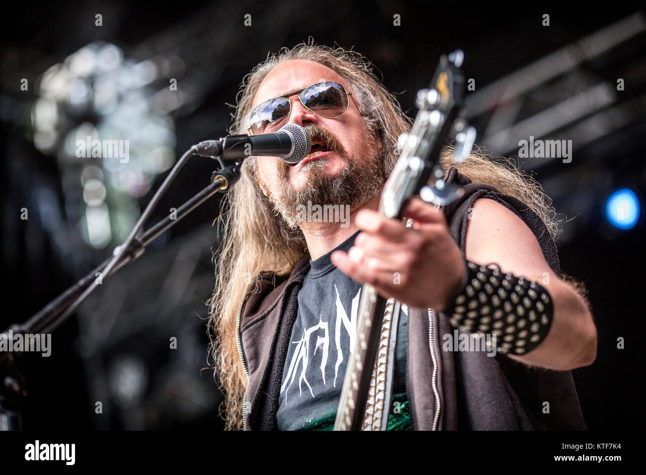 Norway, Borre – August 19, 2017. The Norwegian black metal band Aura Noir performs a live concert at during the Norwegian metal festival Midgardsblot Festival 2017 in Borre. Here vocalist and bassist Aggressor is seen live on stage. Stock Photo