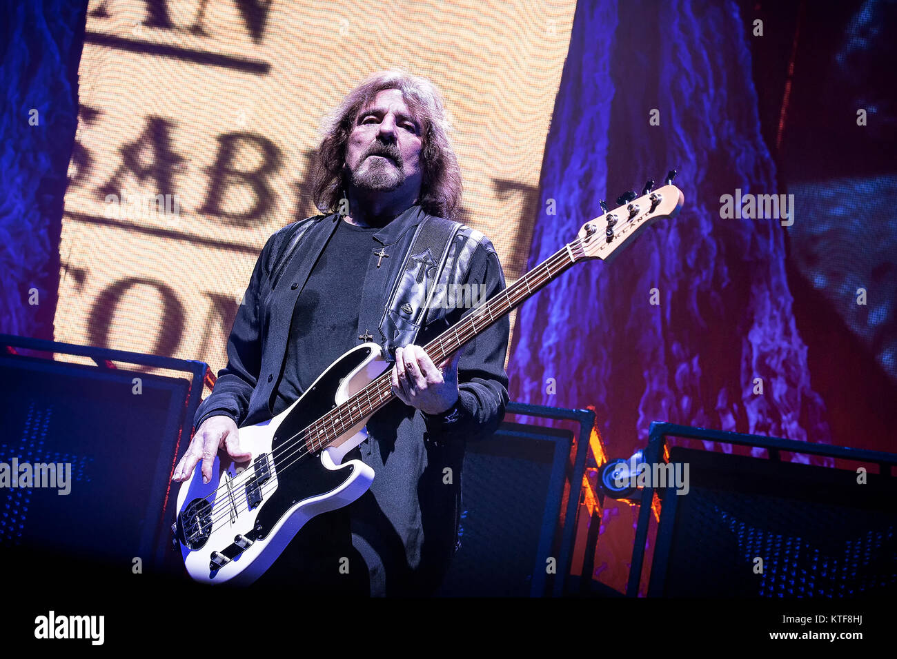 The English rock band Black Sabbath performs a live concert at Telenor Arena in Oslo. Here musician Geezer Butler on bass is seen live on stage. Norway, 24/11 2013. Stock Photo