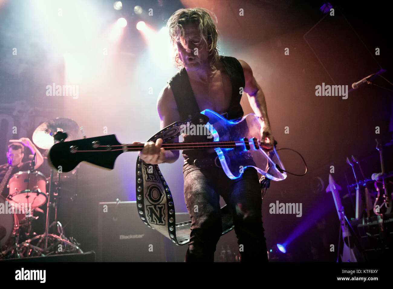 The Danish rock band D-A-D performs a live concert at Rockefeller in Oslo. The band was originally called “Disneyland After Dark” but had a lawsuit from The Walt Disney Company. Here musician Stig Pedersen on bass is seen live on stage. Norway, 17/03 2012. Stock Photo