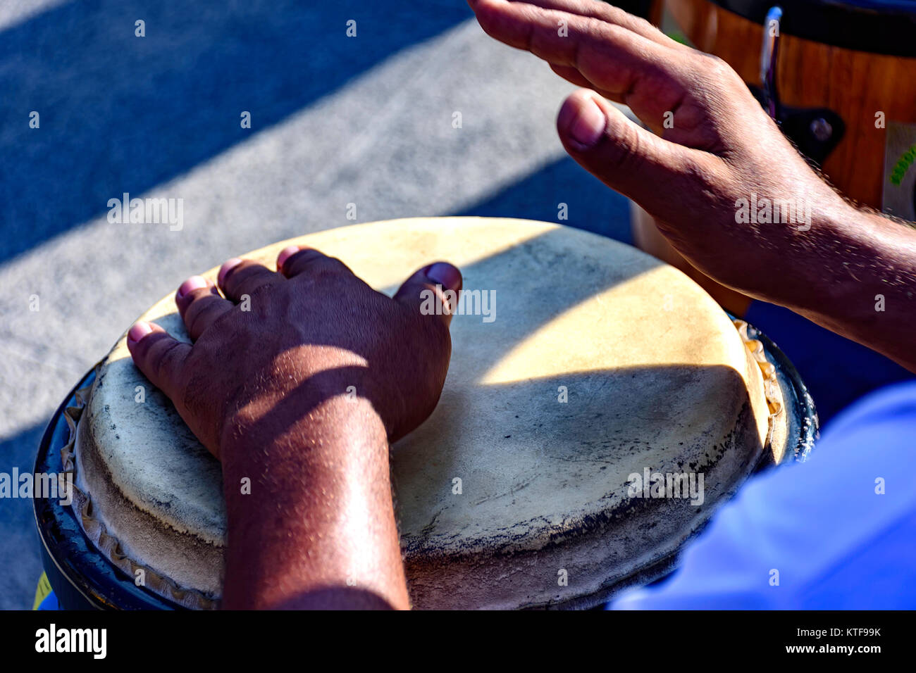 Drum player playing atabaque during presentation of afro music on the eve of the Brazilian carnival Stock Photo