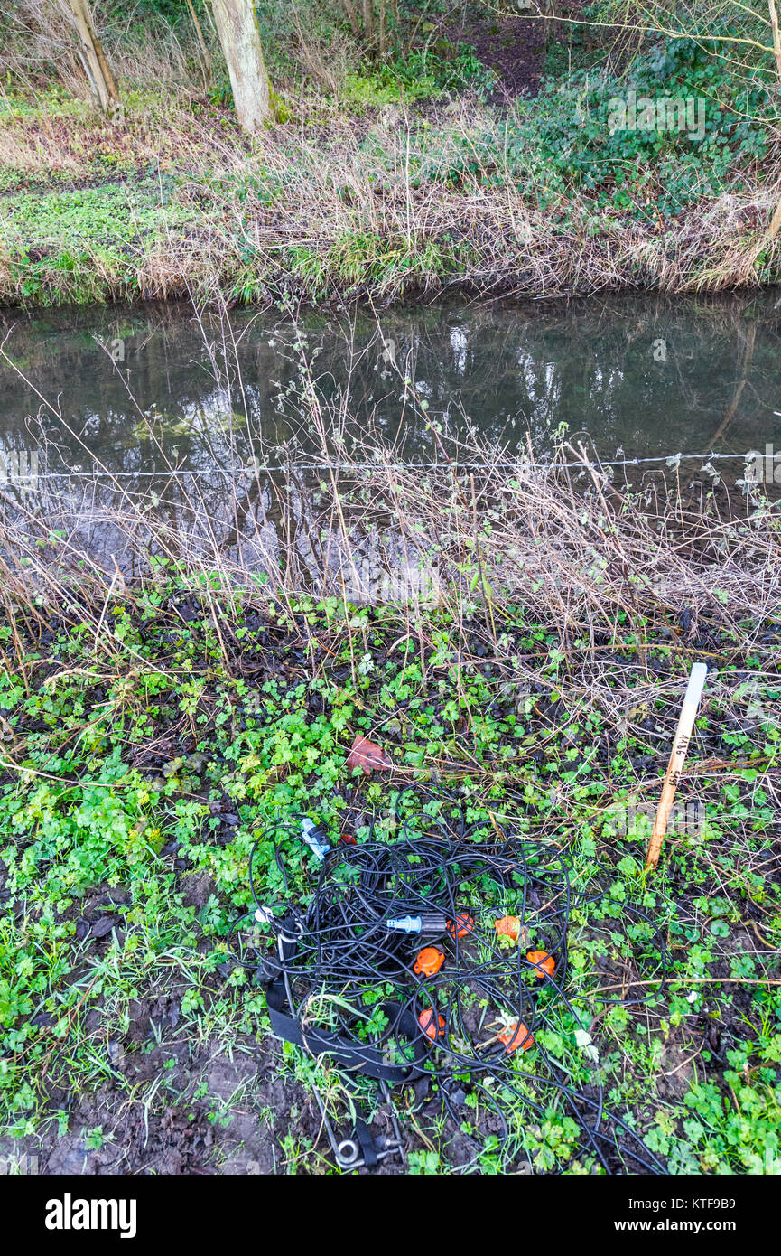 Seismic geophones and recording units at the side of a river. Stock Photo