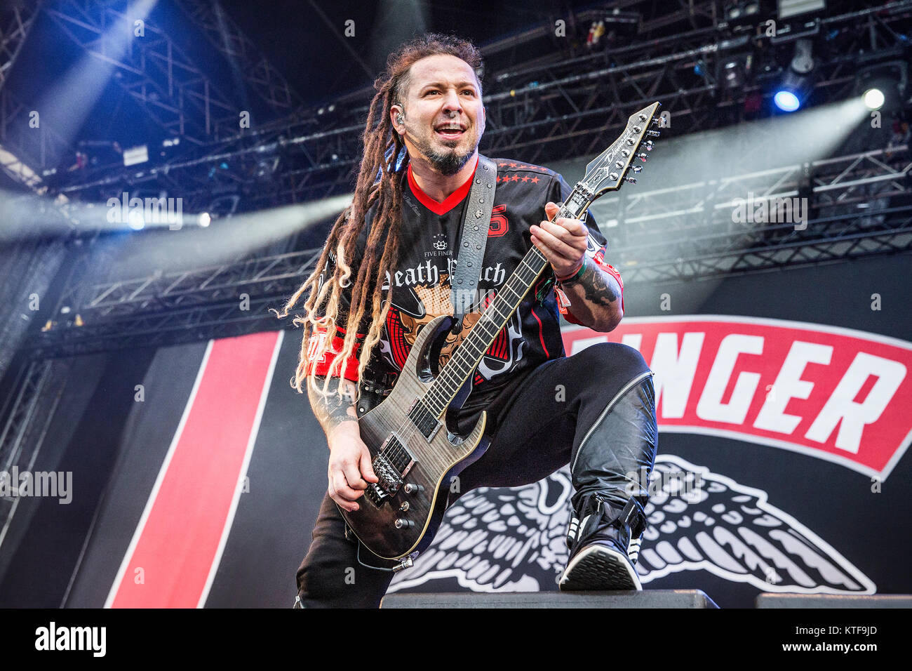 Norway, Halden – June 24, 2017. Five Finger Death Punch, the American heavy band, performs a live concert during the Norwegian music festival Tons of Rock 2017. Here guitarist Zoltan Bathory is seen live on stage. Stock Photo