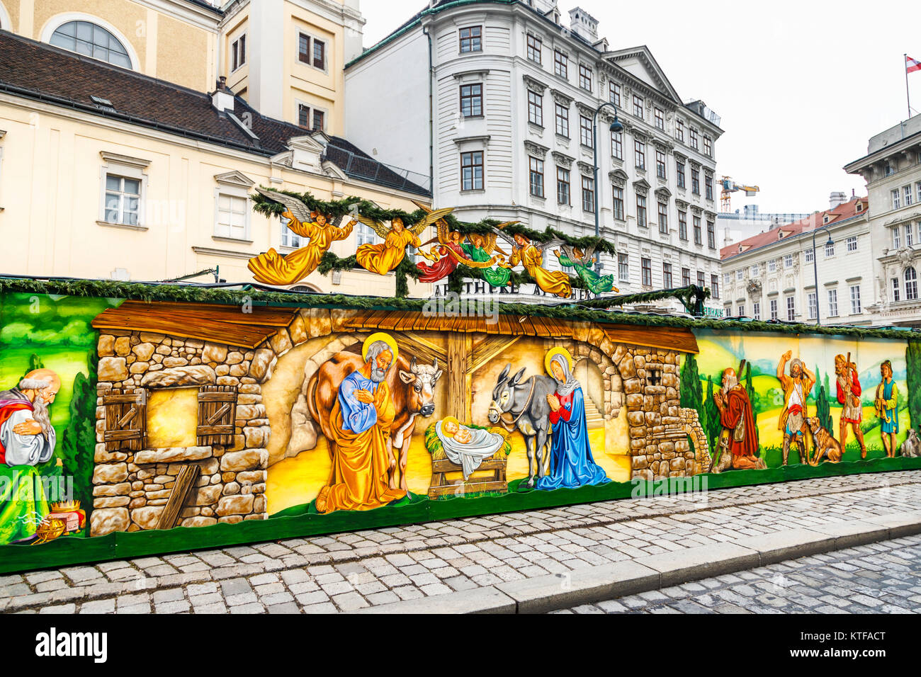 Colourful roadside nativity scene mural at the traditional festive season Altwiener Christkindlmarkt, old Vienna Christmas Market, Freyung, Vienna Stock Photo