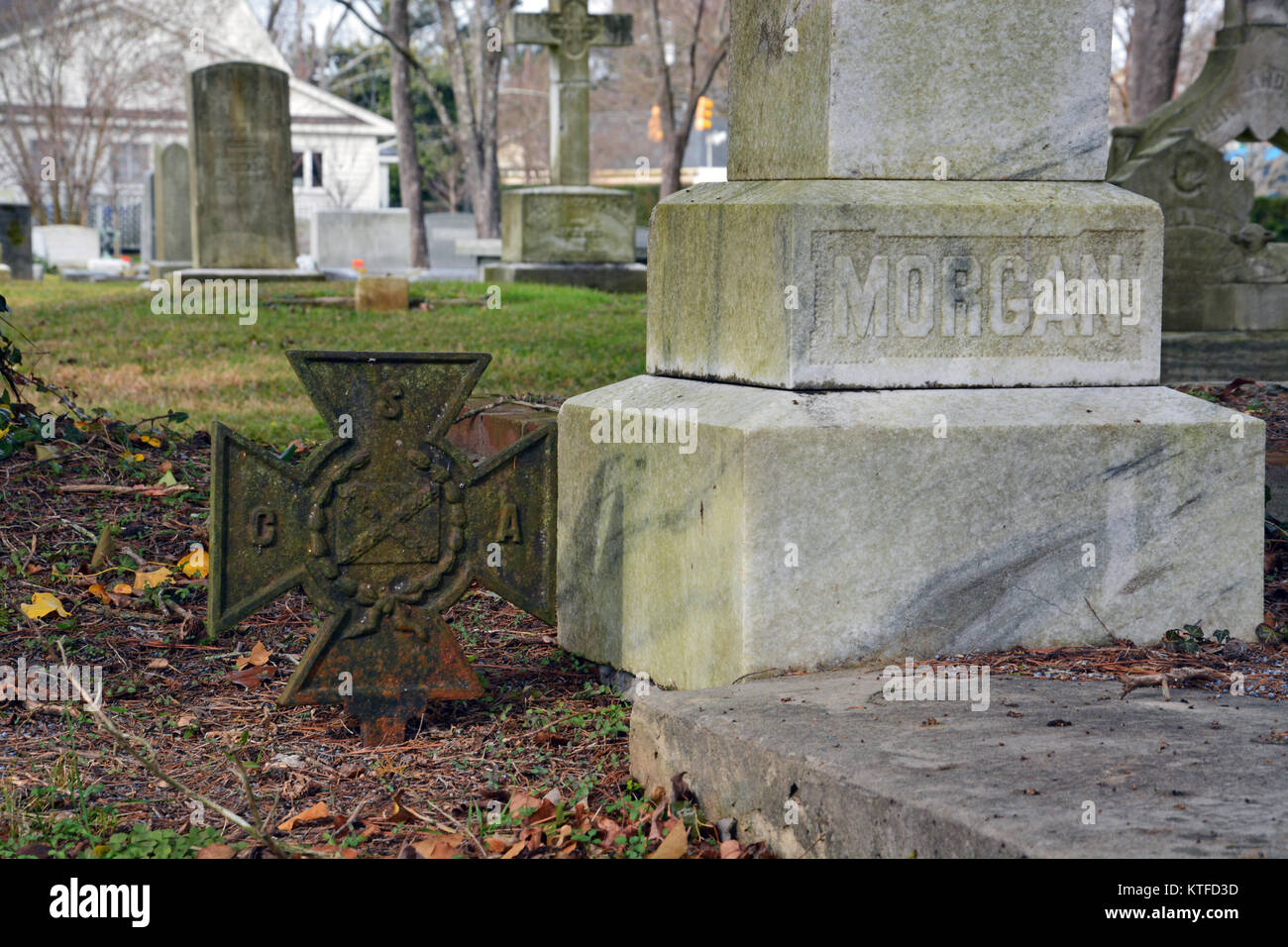 An old weathered CSV Iron Cross signifying the grave site of a