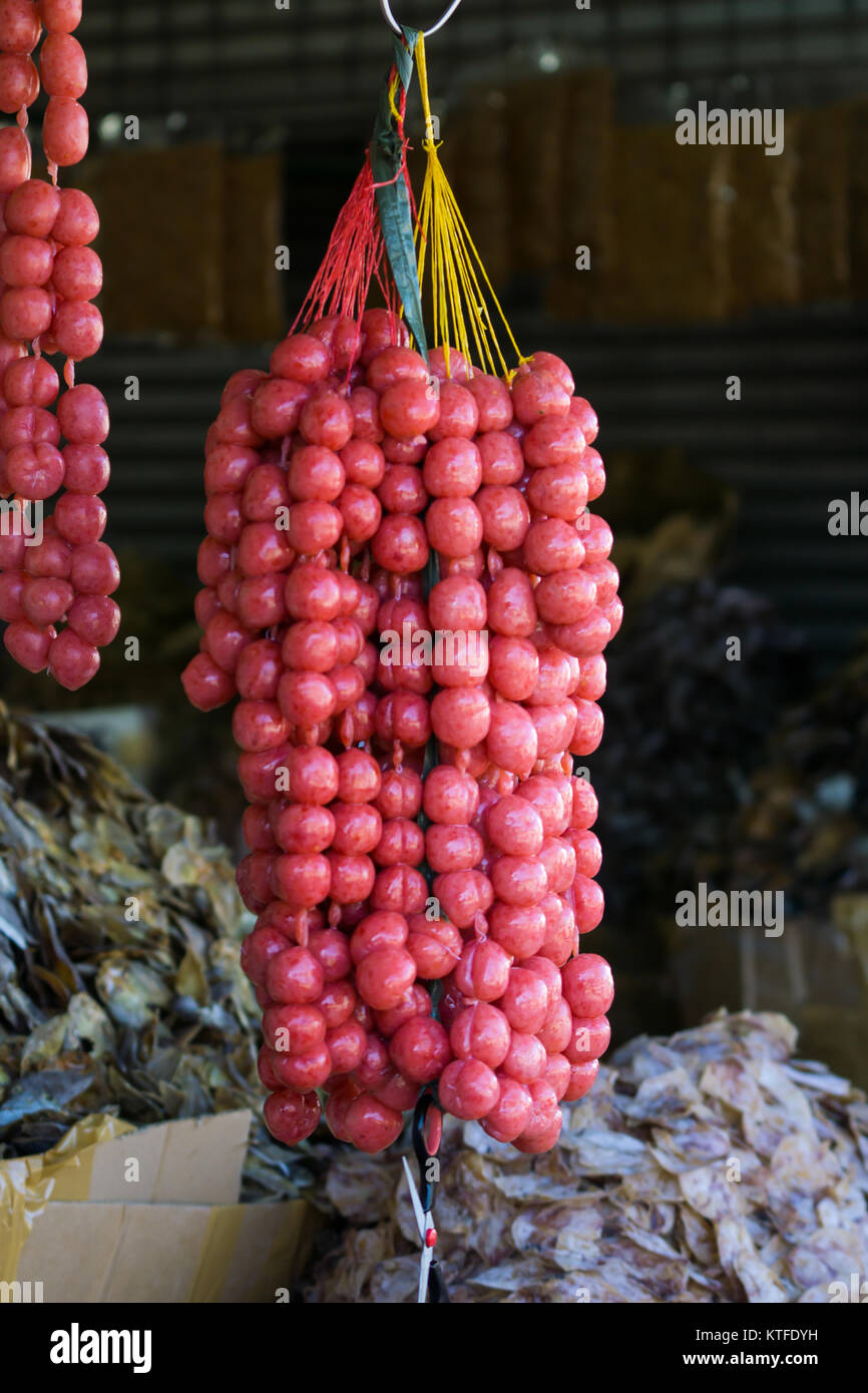 Round Pork sausage meat balls known as Chorizo for sale within Taboan market,Cebu City,Philippines Stock Photo