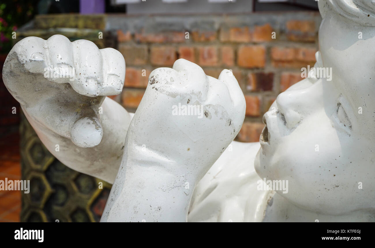 Small angel statue at garden in Cameron Highlands, Malaysia Stock Photo