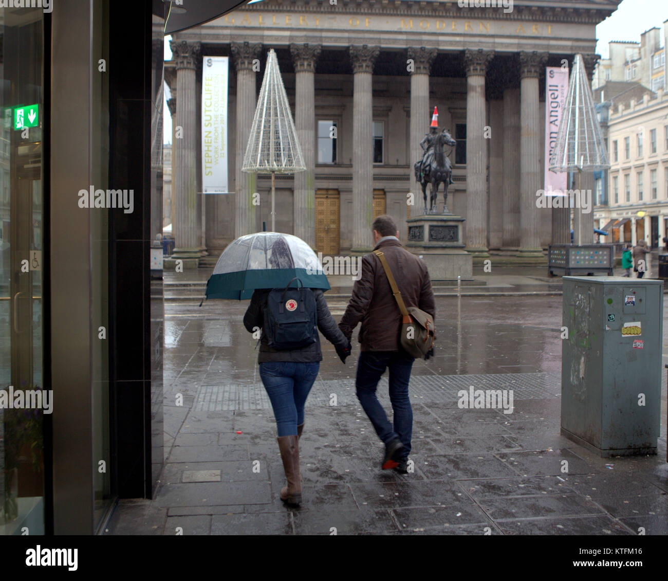 Glasgow, Scotland, UK  24th December.UK Weather: Rain and wind greet the last minute Christmas Eve shoppers to Buchanan street, Glasgow's style mile from Frasers or the streets to princes square shopping centre. Credit Gerard Ferry/Alamy news Stock Photo