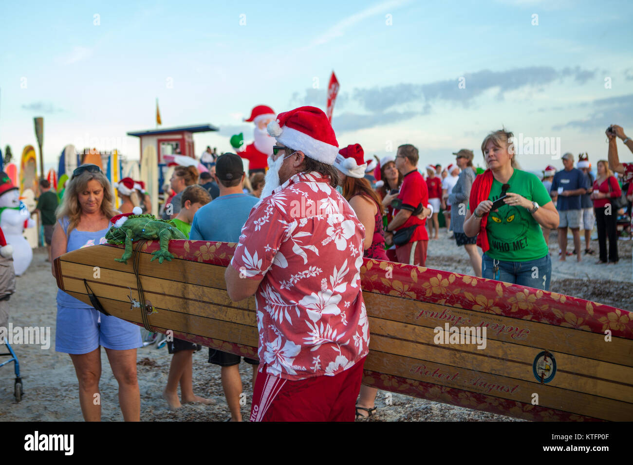Cocoa Beach, Florida, USA. 24th Dec, 2017. Surfing Santas, an annual surf event taking place on