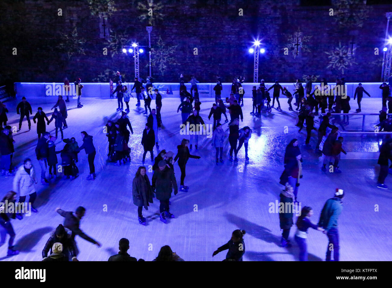 London, UK. 24th Dec, 2017. People ice skating in Tower Bridge skating