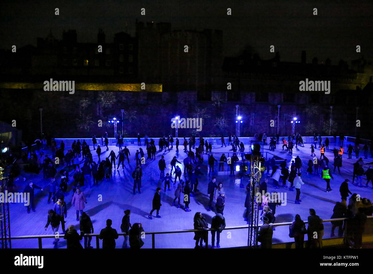 London, UK. 24th Dec, 2017. People ice skating in Tower Bridge skating