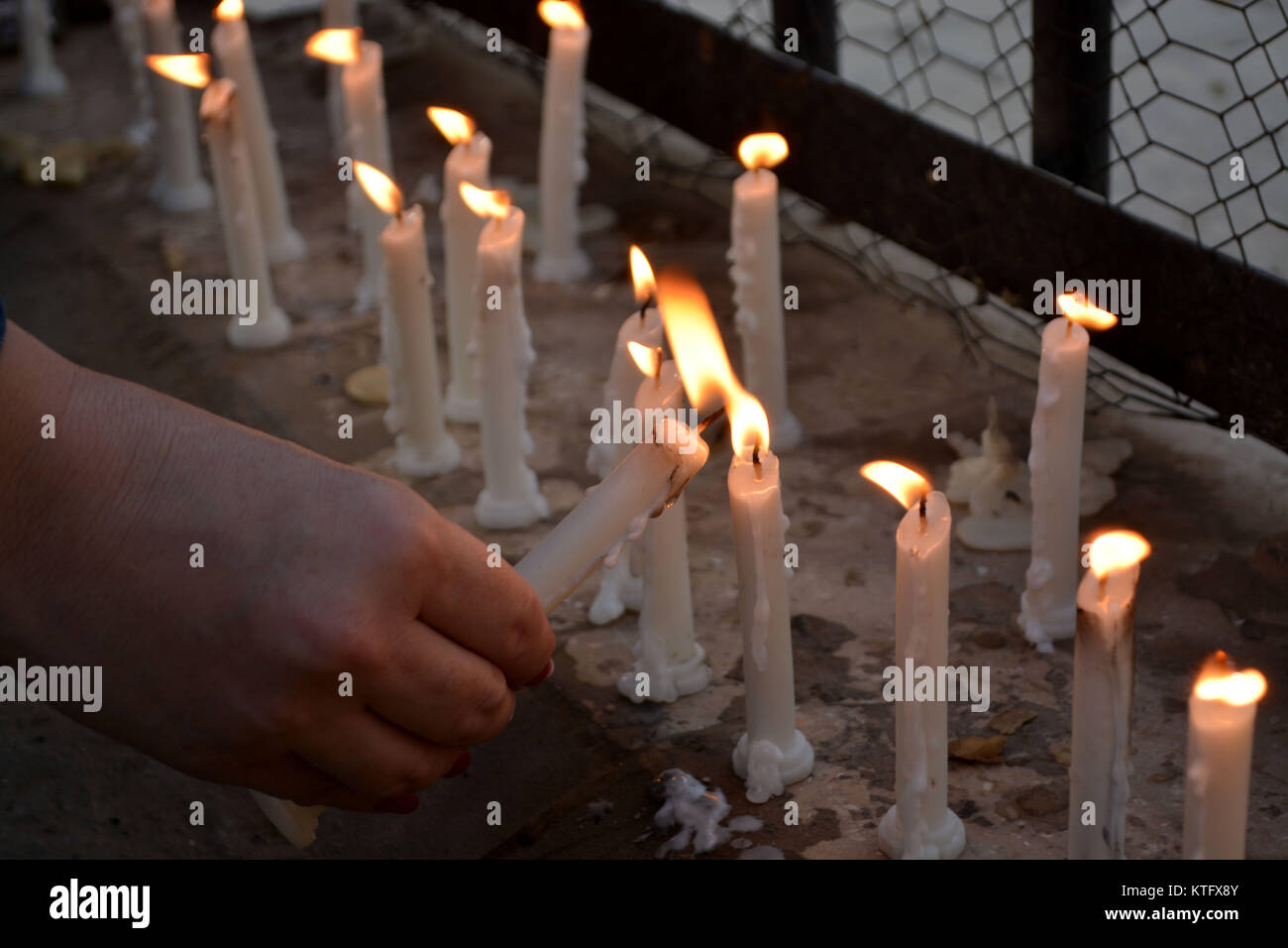 QUETTA, PAKISTAN. Dec-25 2017: Members of Civil society and Host lighting the candles in memory of victims of the terrorist attack on church in Quetta at main jinnah road. At least eight people killed and 30 people got injured. Stock Photo